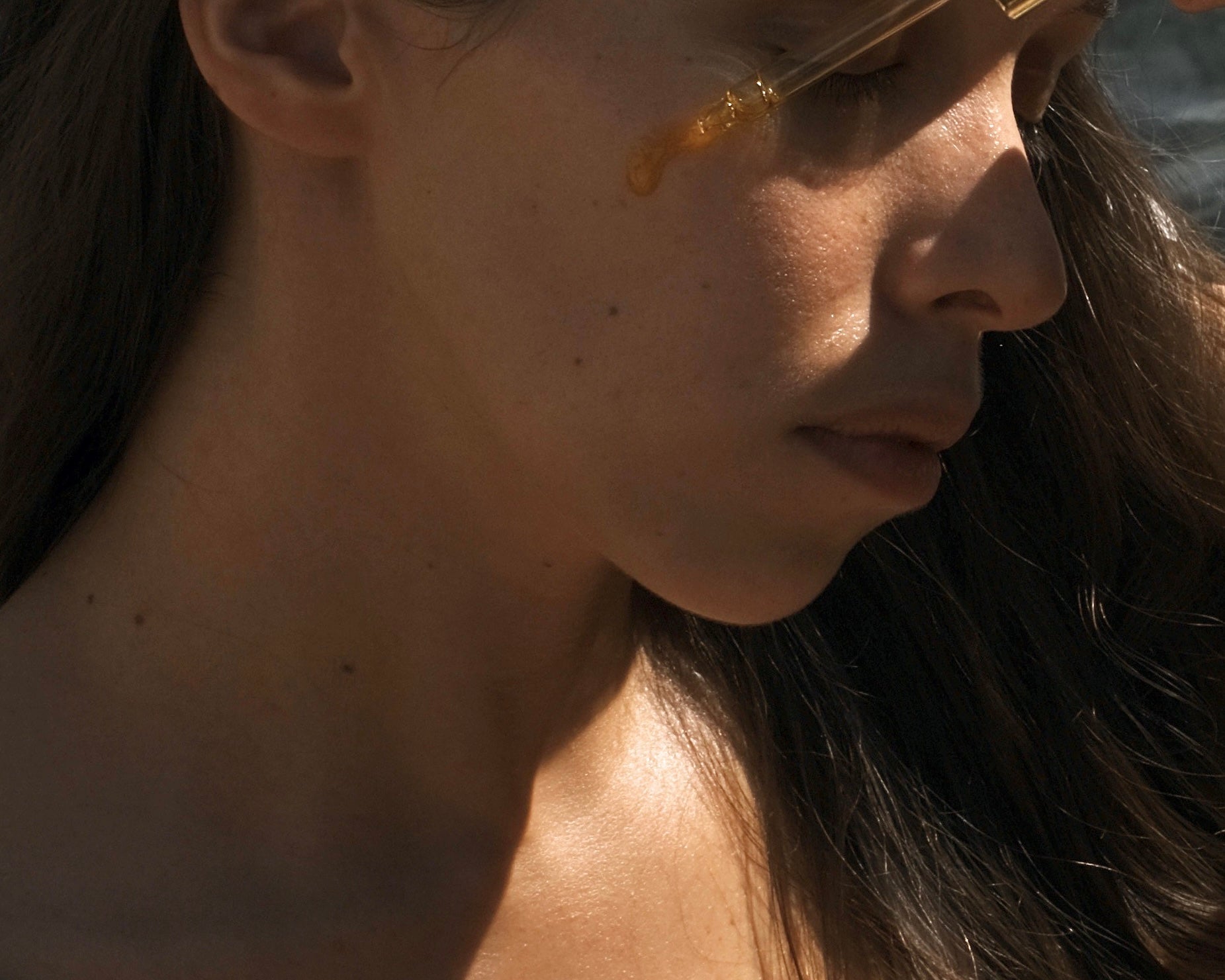 Close-up of Glow Repair Facial Oil dropper with nourishing formula